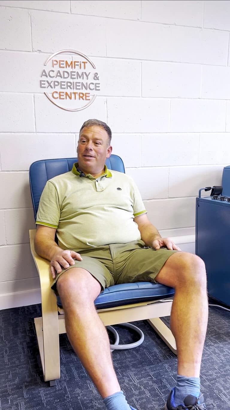 Danny Chamberlain sat in a PEMFiT chair talking through his journey from Debilitating Pain from herniated discs back to a Vibrant Life with PEMF from PEMFiT