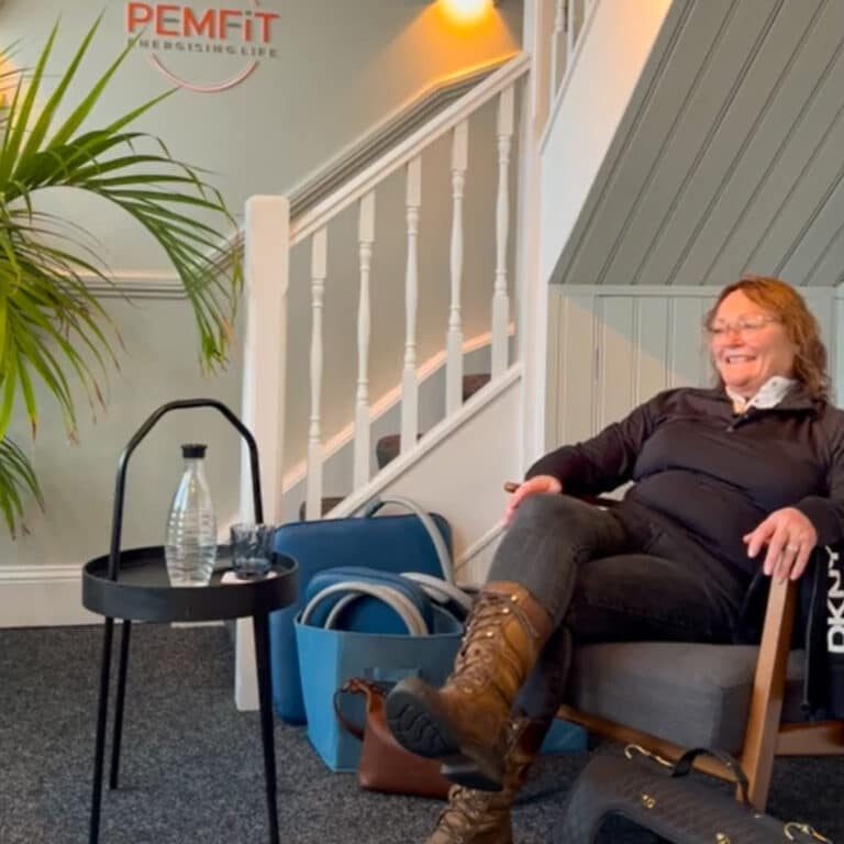 Jane sat in the PEMFiT studio giving her client testimonial